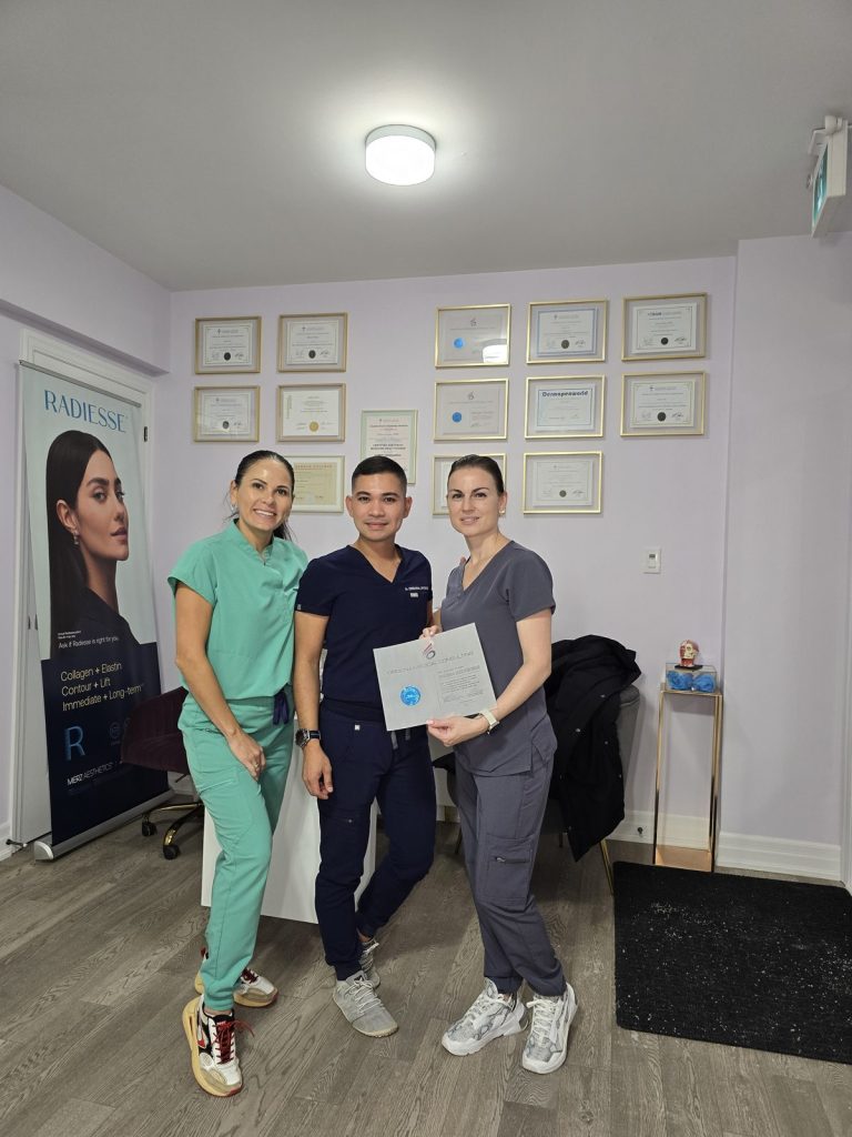 Graduates of an injector training course with their certificate at Beauty Maison Aesthetics