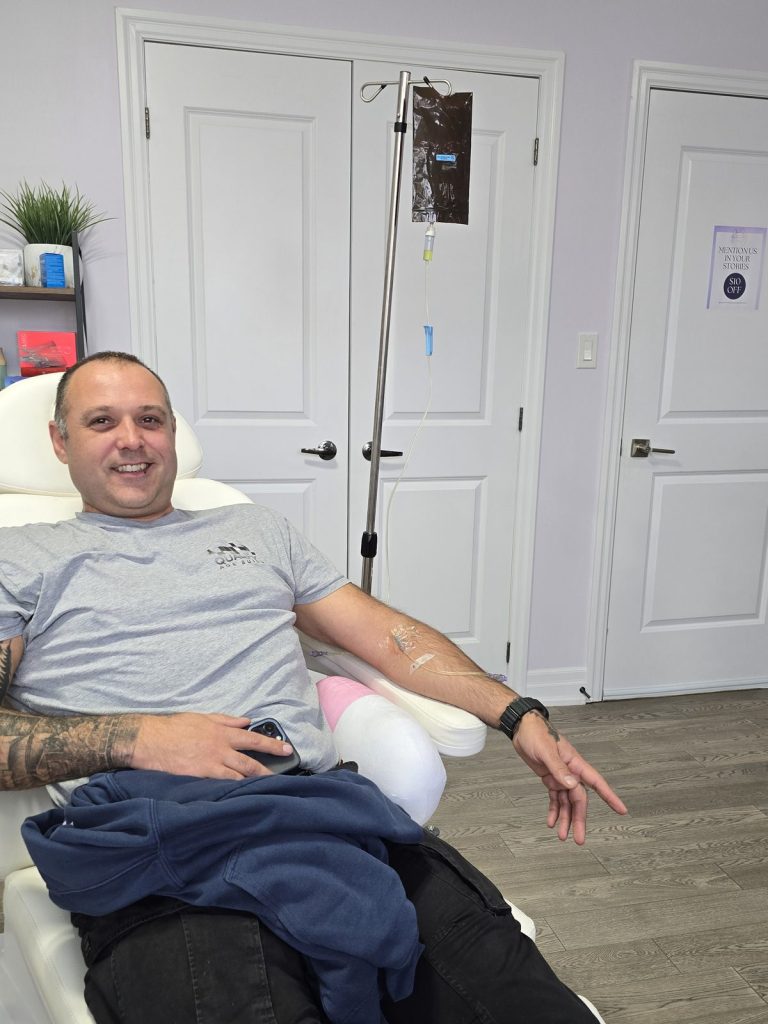 Client receiving an IV infusion in a private treatment room in Vaughan