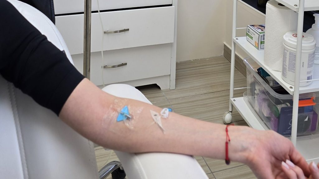 Client's arm with an IV line during a vitamin infusion at Beauty Maison Aesthetics in Maple, Vaughan