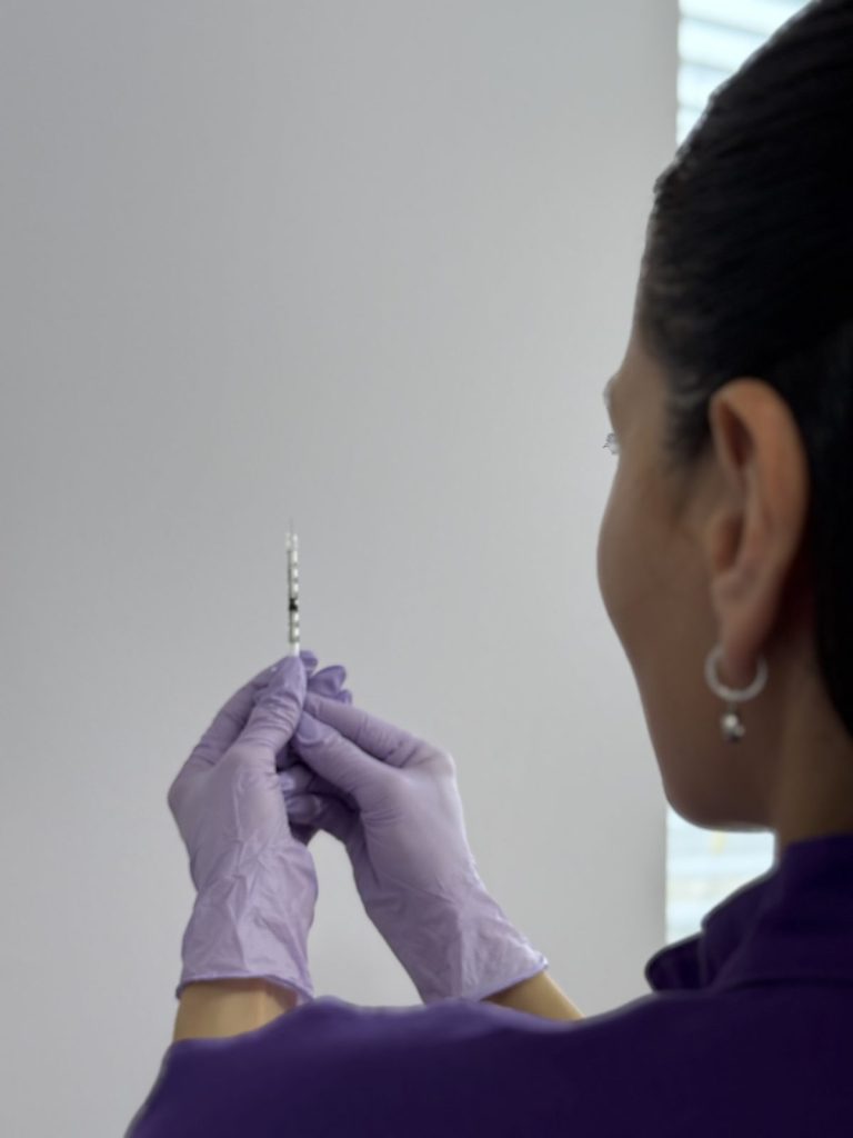 Nurse preparing a vitamin injection in Vaughan