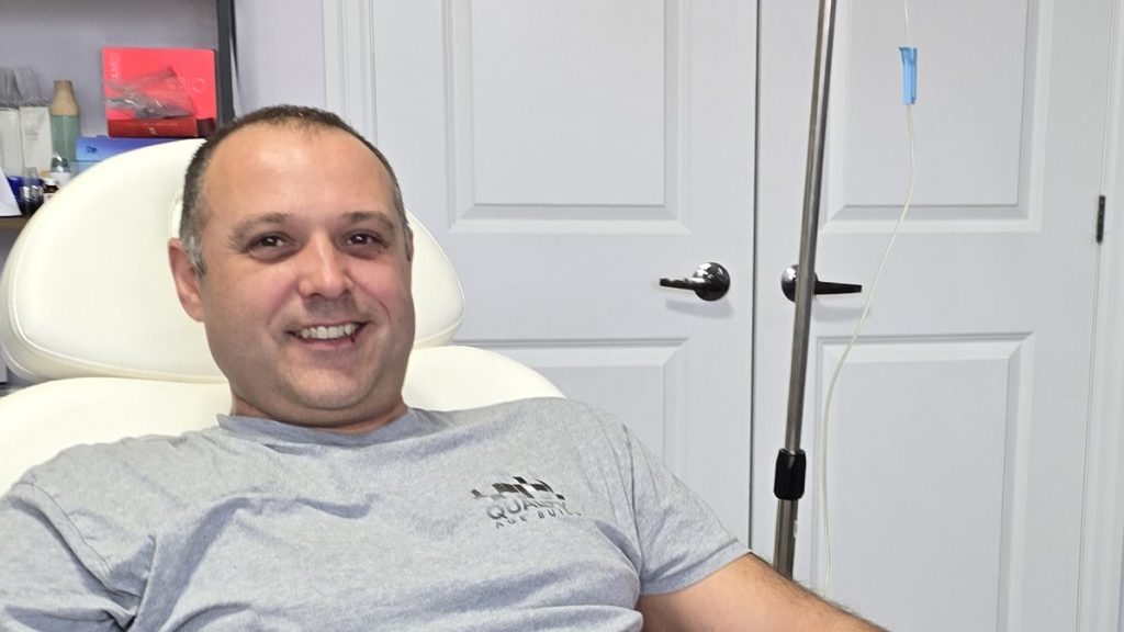 Smiling client relaxing in the treatment chair during a wellness treatment at Beauty Maison Aesthetics in Maple, Vaughan