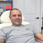 Smiling client relaxing in the treatment chair during a wellness treatment at Beauty Maison Aesthetics in Maple, Vaughan